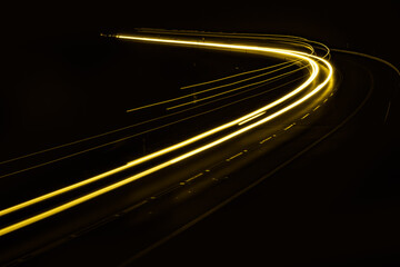 yellow car lights at night. long exposure