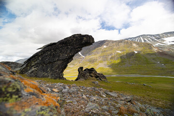 Large rock formation in Sarek National Park, Sweden. Summer landscape of Northern Europe mountain wilderness area.