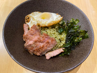 Green chili fried rice with sliced beef and fried egg