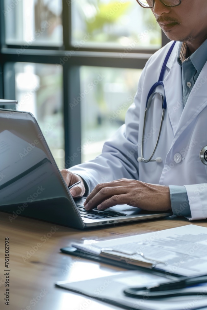 Poster A man in a lab coat working on a laptop. Suitable for science and technology concepts