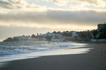 Spain Andalusia evening coast beach line waves on sand