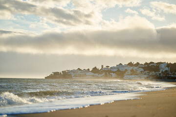 Spain Andalusia evening coast beach line waves on sand