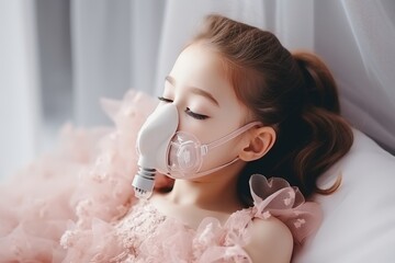 Young 5 year old girl in hospital bed with oxygen mask, recuperating from illness in medical ward