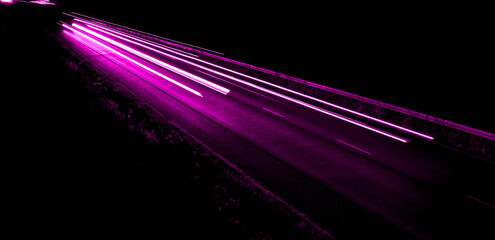 violet car lights at night. long exposure