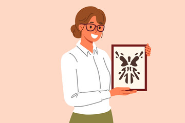 Rorschach test in hands of woman psychotherapist, want to find out psychological state patient with mental disorder. Girl psychotherapist with smile demonstrates abstract painting in form of blot.
