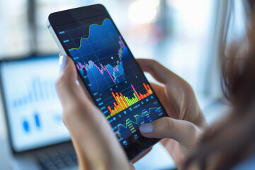 Stock trading investor, trader or broker using crypto exchange platform app on smartphone analysing exchange market chart investing money in financial market on mobile screen with cell phone in hands.