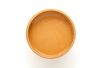 Jar of peanut butter on white