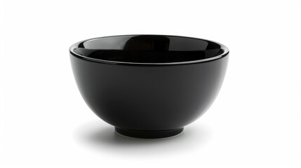 Close up of a black bowl on a white surface, suitable for food photography projects