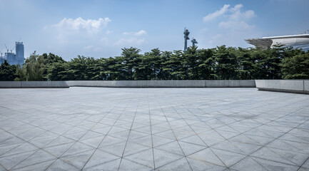 Empty square floor and green forest with sky clouds background. Panoramic view.