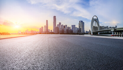 Asphalt road highway and modern city buildings at sunset in Guangzhou