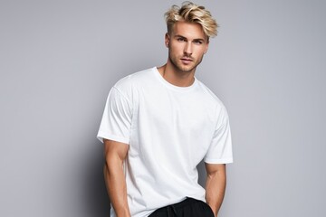 Blond, sporty European male, 25 years old, sporting a short hairstyle, docks a pose wearing an...