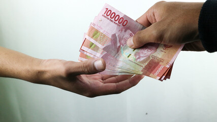 Hand hold money rupiah,transaction concept, financial concept