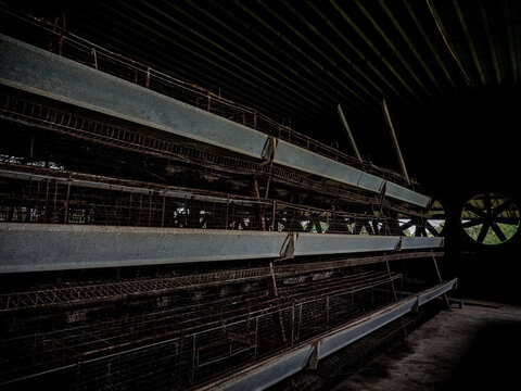 The empty laying cages of poultry houses, old, decayed, abandoned