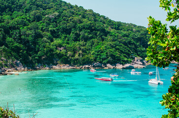 Naklejka na ściany i meble Tropical islands of ocean blue sea water and white sand beach at Similan Islands with famous Sail Rock, Phang Nga Thailand nature landscape