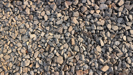 small road stone background, dark gravel texture, stone pebbles, seamless texture. Railroad gravel.