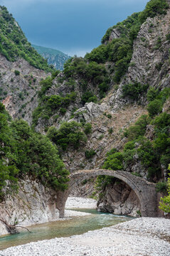 View of the traditional stone Leskovitiko bridge at Agrafa mountains near the village of Petroto in Thessaly, Greece