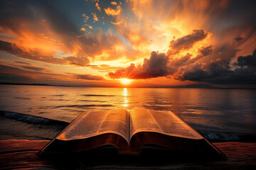 Open old book with a dramatic sunset in backdrop. Reading concept - obrazy, fototapety, plakaty