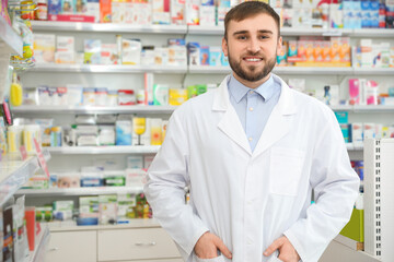 Portrait of professional pharmacist in modern drugstore
