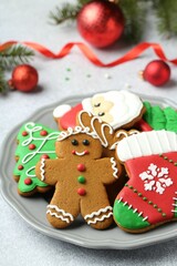 Fototapeta na wymiar Tasty homemade Christmas cookies on light grey table