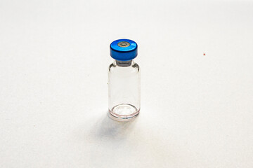 empty bottle with medicines for treatment and vaccinations on a white background. Routine...