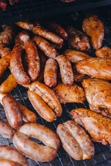 Pork being barbequed in a southern style pit over hickory wood.