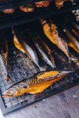 Pork being barbequed in a southern style pit over hickory wood.