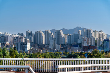 Seoul cityscapes, skyline, high rise office buildings and skyscrapers with blue sky and cloud in...