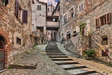 Abwaschbare Fototapete Enge Gasse Anghiari, Arezzo, Tuscany, Italy: ancient narrow alley with staircase in the Tuscan medieval village