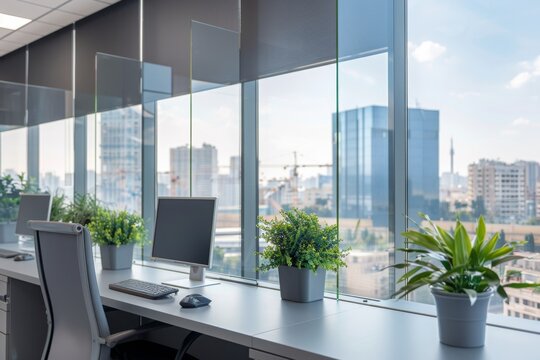 An aluminum window with sliding mechanism that is installed in an office for allowing natural light and ventilation. It is made of glass and is used for separation and access purposes. The office also
