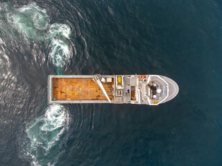 ASD Offshore supply vessel from above, testing propulsion. Aft azimuth thruster propeller wash. DP trails.