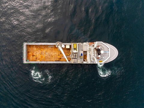 ASD Offshore supply vessel from above, testing propulsion. Aft azimuth thruster propeller wash. DP trails.
