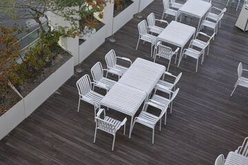 Tables and chairs seen from above.