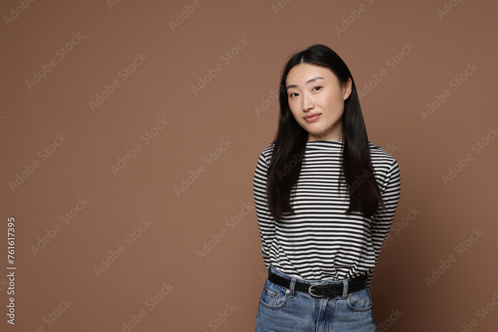 Sticker Portrait of beautiful woman on brown background. Space for text