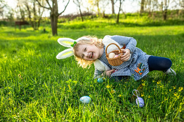 Joyful kid embarks on an Easter egg hunt, eagerly filling their basket with painted treasures...