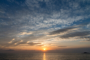 Naklejka na ściany i meble View of the sunrise over the sea