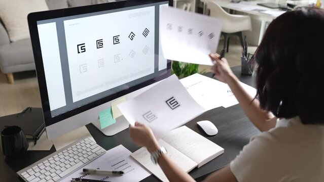 Asian Graphic designer working in office. Designing logo Artist Creative Designer Illustrator Graphic Skill Concept.