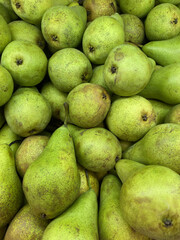 A lot of pears are in the juice box, ripe, green, sweet, delicious