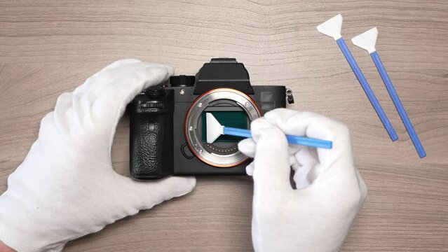 Removing sensor dust from a modern digital mirrorless full frame camera sensor using a sensor swab &ndash; top view
