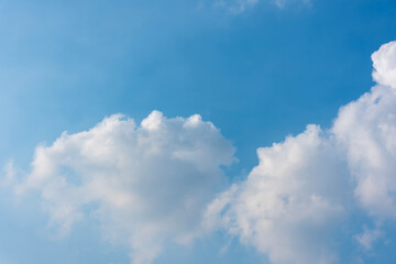 Naklejka na ściany i meble Blue sky with the big white clouds.