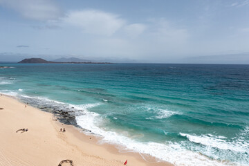 Stunning morning view of the islands of Lobos and Lanzarote seen from Corralejo Beach (Grandes Playas de Corralejo) on Fuerteventura, Canary Islands, Spain,