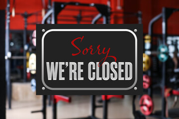 Sorry we are closed sign against blurred background