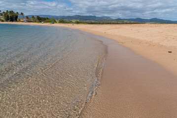 Long sandy beach near ocean on sunny topical day - 761666718
