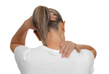 Woman suffering from pain in her neck on white background, back view