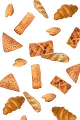 Different tasty puff pastries falling on white background
