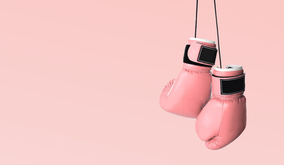 Fight against breast cancer. Pair of pink boxing gloves on color background, space for text. Banner...