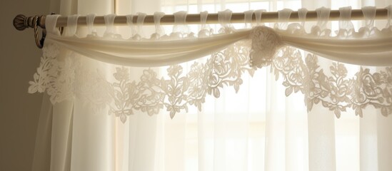 A white curtain with a lace trim is hanging on a window, adding a touch of elegance to the room. The window treatment complements the wood flooring and glass windows - obrazy, fototapety, plakaty