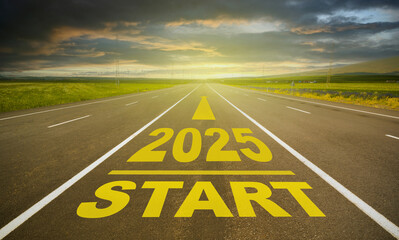 2025 lettering on empty asphalt road. Road in the countryside going straight at sunset. 2025 new...