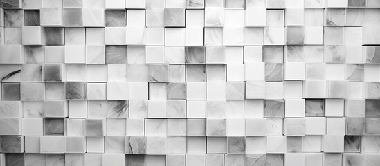 A monochrome image showcasing a brickbuilt wall composed of squares and rectangles. The grey tones highlight the building materials symmetry and composite properties