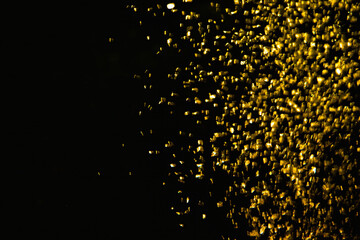 gold glittering on black background