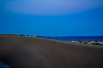Sunset, Moon and Evening Sky over Maspalomas on Gran Canary Island Spain.